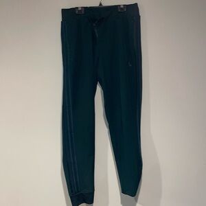Dark green adidas track pants size Medium